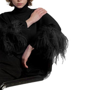Maglione in lana merino con piume 